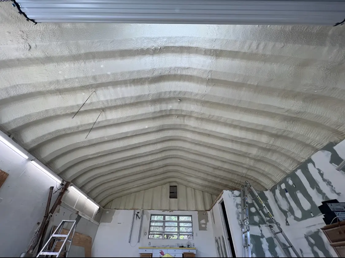 Spray polyurethane foam applied to the underside of a metal roof deck in Flat Rock